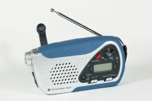 Dual: Small windup clockwork dual band radio with torchlight