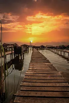 Jetty: Small wooden houses with a jetty in a lake, they