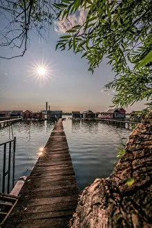 Jetty: Small wooden houses with a jetty in a lake, they