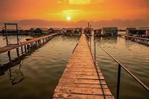 Jetty: Small wooden houses with a jetty in a lake, they
