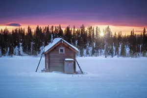 Reflex: Small wooden hut against the light at extremely