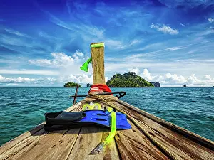 Cable: Snorkeling set on boat heading to tropical island