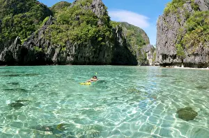 Snorkeller: A snorkeller swims into an entry of a Big Lagoon