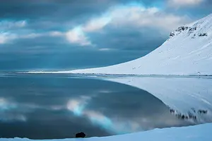 Grundarfjrdur: Snow-covered coastal landscape with water reflection