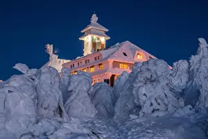 Snowed: Snow-covered Fichtelberghaus in the evening in winter