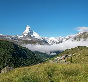 Eggen: Snow-covered Matterhorn, mountain village with wooden