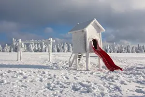 Snowed: Snow-covered playground in winter on the Fichtelberg