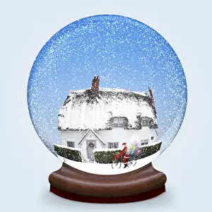 Cycling: Snow globe of thatched cottage in winter snow