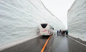 Passenger: Snow Wall Walk, high snow wall on a road with bus