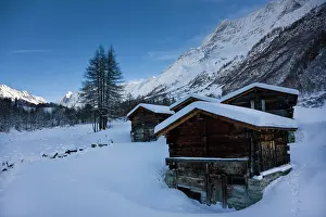 Jungfrau: snowed in alp alm buildings in Loetschental