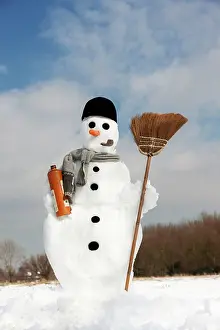 Broom: Snowman - with broom and bottle of Gin in snow landscape
