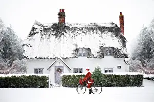 Bicycles: snowy cottage santa claus