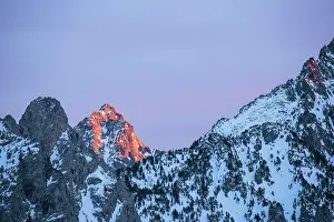 Sergio Arias: Snowy Mountains illuminated by the sun