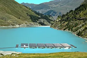 Cell: Solar panels floating on the mountain lake Lac des