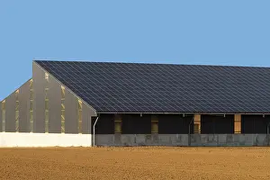Panels: Solar panels on the roof of a farm
