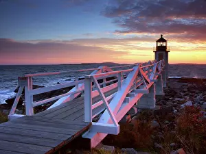 Access: Spectacular sunset behind Marshall Point Lighthouse