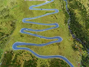 Winding: Splagen Pass, winding Swiss Alpine pass, drone photo