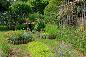 Tool: Square foot kitchen garden and tomatoes supported