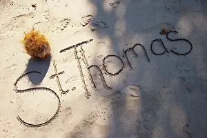 Thomas: St. Thomas written script in the sand of
