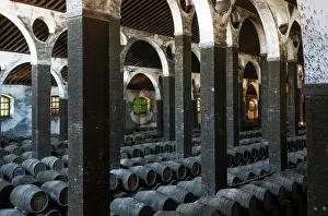Stacked: Stacked oak barrels in the cellar La Catedral at the B