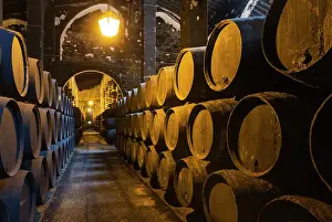 Stacked: Stacked oak barrels in one of the cellars at the Bodegas