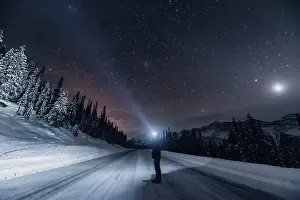 Roads: Starry sky during a winter road trip on the Icefields Parkway with lots of snow and ice