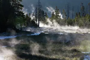 Midway: Steam - rising from runoff water in streams - early