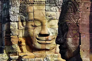 Khmer: Stone face in the ruins of the Bayon Khmer Temple, Angko