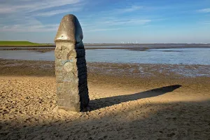 Penis: Stone penis, sculpture in the mudflat landscape