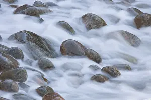 Shingle: Stones in the waves at coastline - Kullaberg - Skane, Sweden