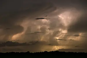 Electrical: Storm clouds in the night lit up by lightning