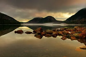 Main: A stormy sunrise at Jordon Pond in Acadia Natio