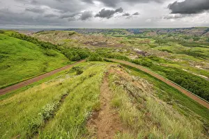 Roads: Stormy weather over the badlands of the Red Deer River valley near the Dry Island Buffalo Jump in southern Alberta