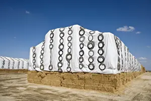 Stocking: Straw stacks covered with tarpaulins in California USA