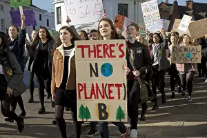 Students: Students on strike carrying banners demanding government