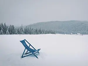 Skiing: Sunbed type chair on the top of a mountain in a