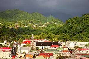 Dominica: Sunlight warms the town of Roseau under