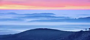 Brocken: Sunrise on the Brocken, view over hills and forests