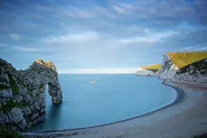 Features: Sunrise over Durdle door and the Jurassic Coast
