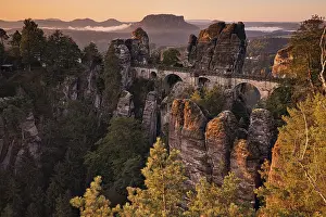 Bridge: Sunrise, golden hour, rocks, mountains