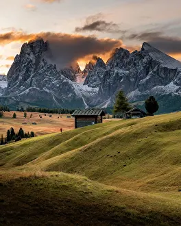 Huts: Sunrise, Hiker, Alpine meadows with huts and trees
