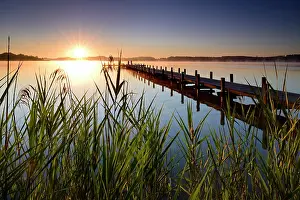 Lakesides: Sunrise, jetty on lake W&, xf6;rthsee, Bavaria