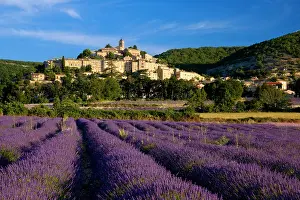 Hilltop: Sunrise over lavender field and the village