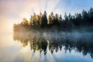 Etang: Sunrise over the mirror-smooth mire lake Etang de