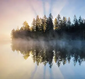 Etang: Sunrise over the mirror-smooth mire lake Etang de