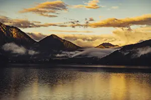 Tyrol: Sunrise with reflections and alpenglow in Lake Heiterwanger See in Tyrol in the Alps in Austria