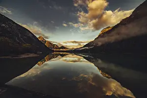 Tyrol: Sunrise with reflections in Lake Heiterwanger See in Tyrol in the Alps in Austria