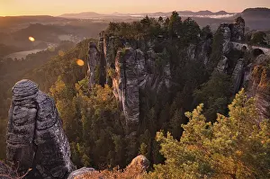 Bridge: Sunrise, rocks, mountains, forest