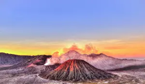 Smoking: Sunrise, smoking Mount Bromo, Mt. Batok at front