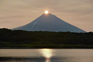 Kamchatka: Sunrise over the summit of the Ilyinsky volcano